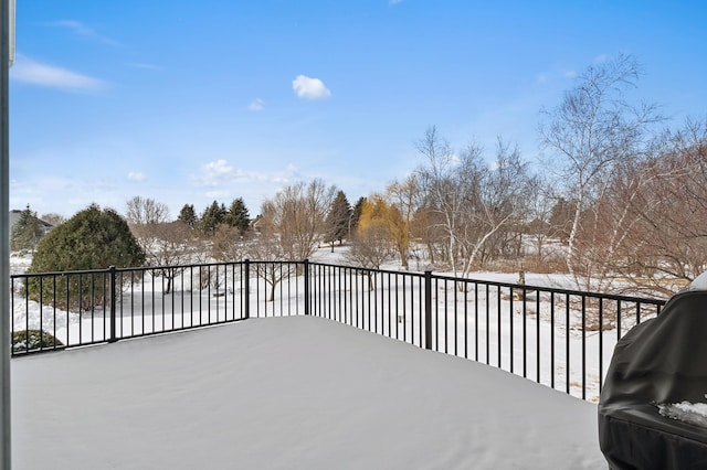 snow covered deck with area for grilling