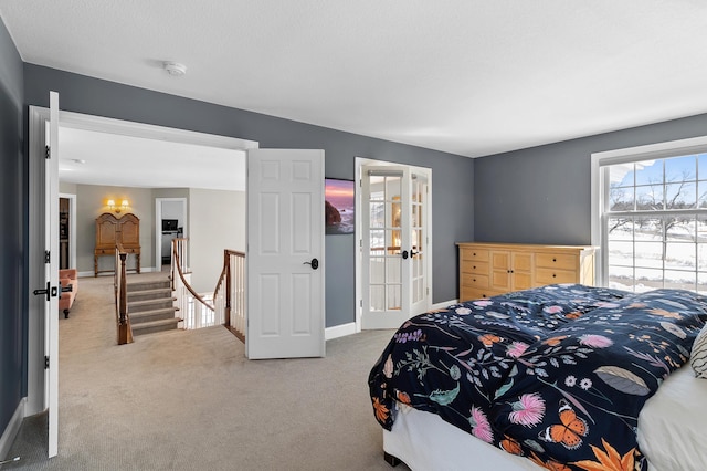 bedroom with baseboards and carpet floors