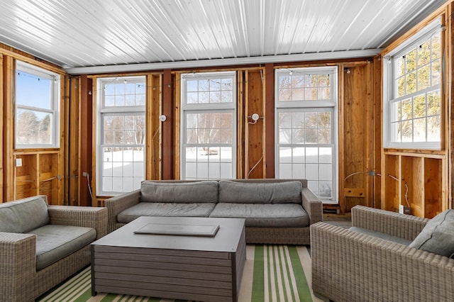 sunroom featuring wood ceiling