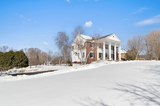 view of snow covered property