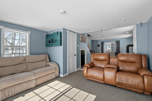 living room with recessed lighting, carpet flooring, and baseboards