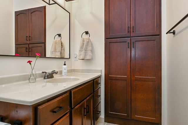 bathroom featuring a closet and vanity