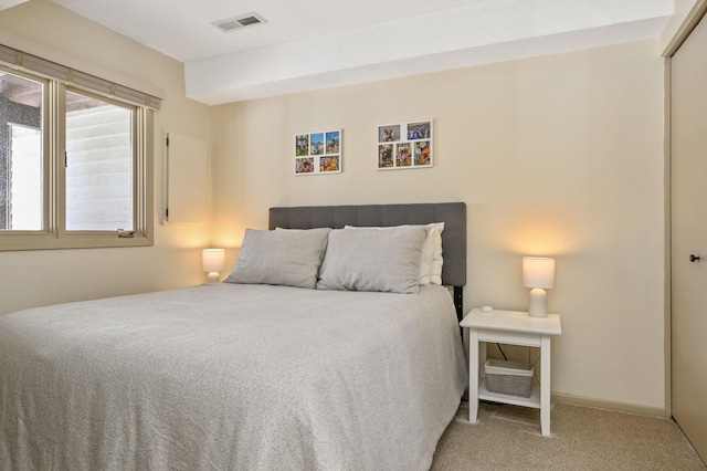 bedroom featuring carpet, a closet, visible vents, and baseboards