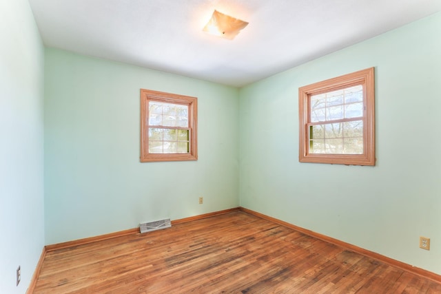 empty room featuring hardwood / wood-style floors