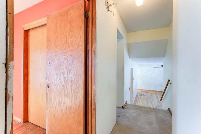 hallway with light hardwood / wood-style floors