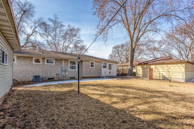 view of yard with a patio, fence, and central AC