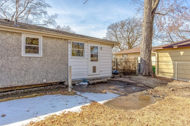 back of property featuring a patio area, stucco siding, and fence