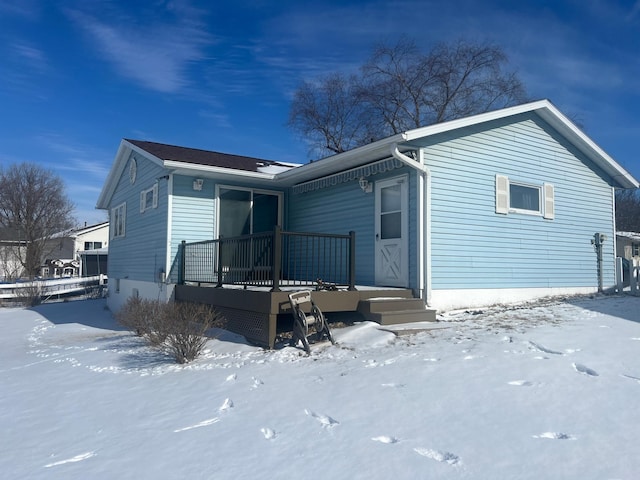 view of snow covered house