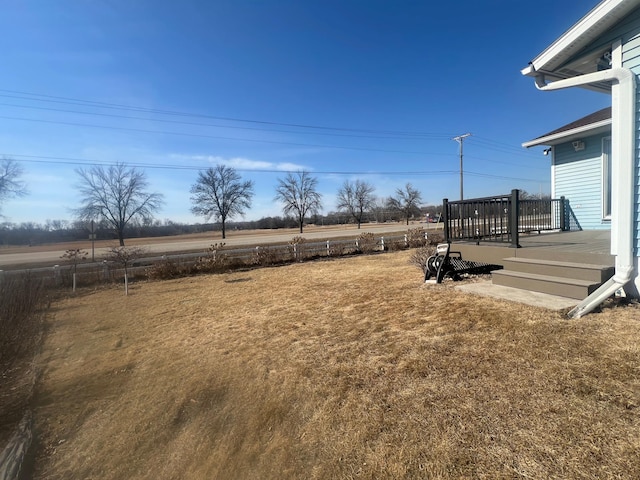 view of yard with a wooden deck