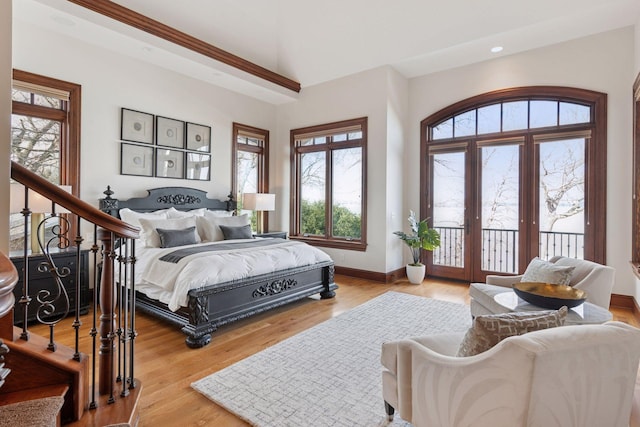 bedroom with baseboards, recessed lighting, wood finished floors, and access to exterior