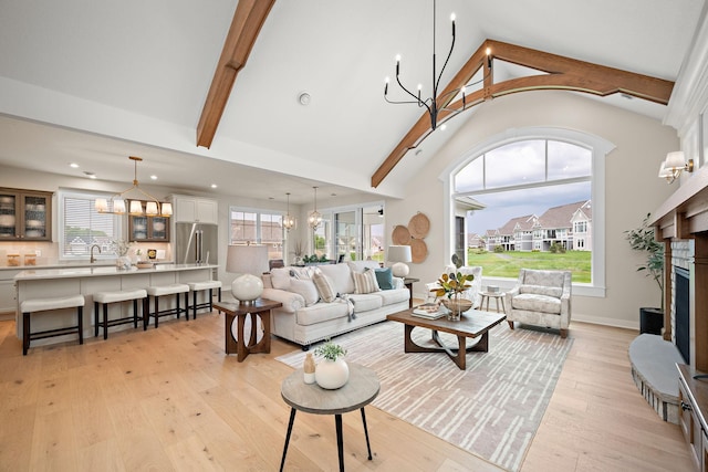 116 Spring Farm Rd, North Oaks, MN 55127 - living room with a chandelier, light wood-style flooring, beamed ceiling, recessed lighting, and high vaulted ceiling
