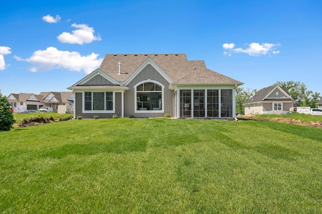 116 Spring Farm Rd, North Oaks, MN 55127 - rear view of house featuring a yard, board and batten siding, and a shingled roof