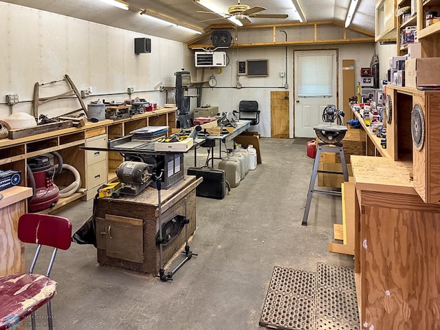 misc room featuring a ceiling fan, lofted ceiling, and a workshop area