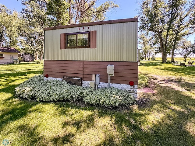 view of property exterior with a yard