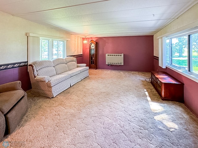 carpeted living area with heating unit