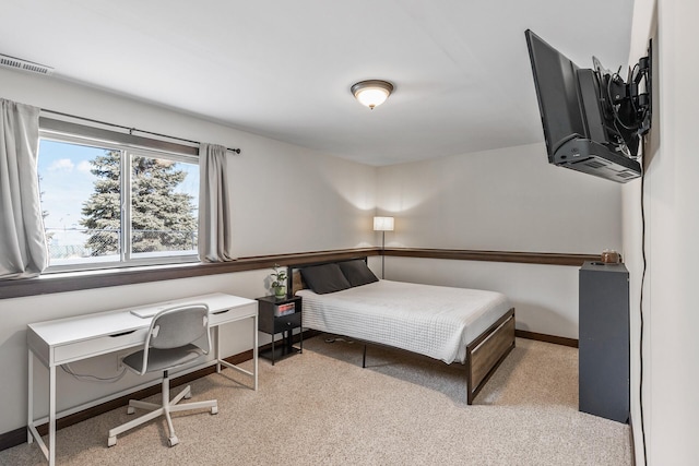 carpeted bedroom with baseboards and visible vents