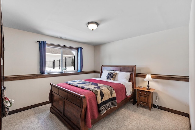 bedroom featuring visible vents and baseboards