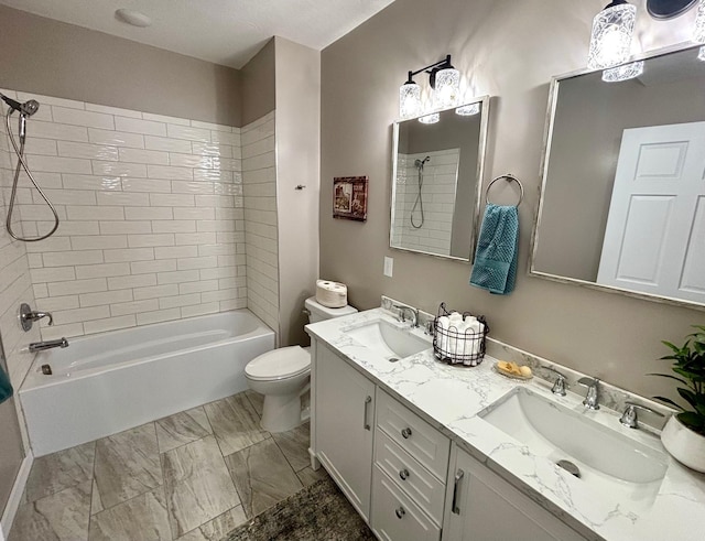 full bath with bathtub / shower combination, a sink, marble finish floor, and toilet