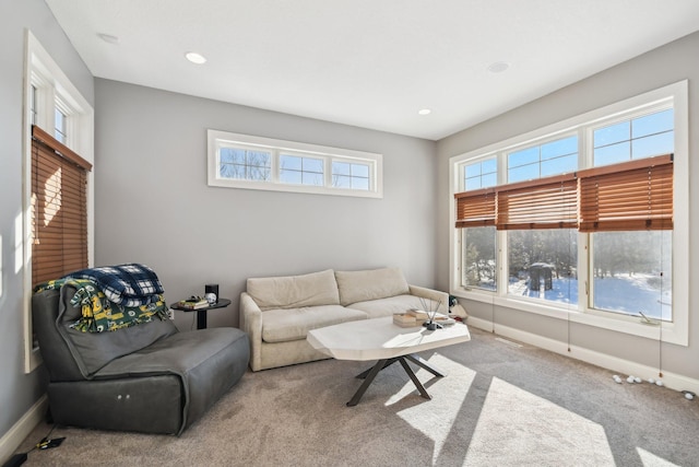 carpeted living room featuring recessed lighting and baseboards