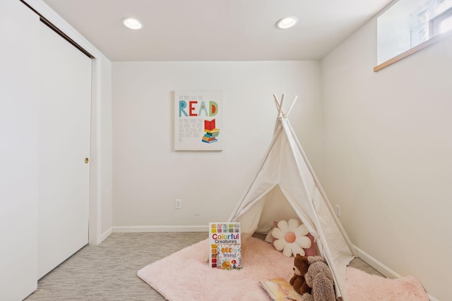 rec room featuring light carpet, baseboards, and recessed lighting