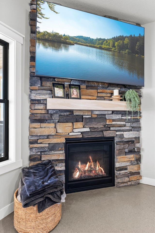 room details with a fireplace and baseboards