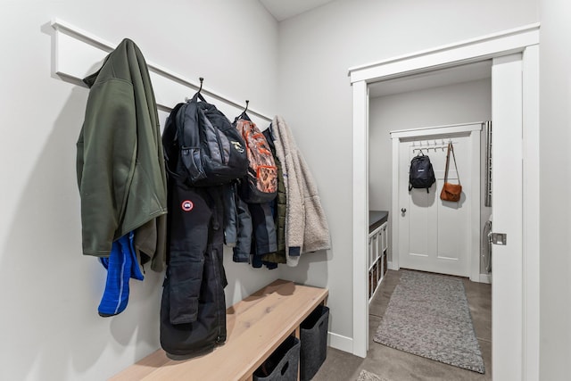 mudroom with concrete flooring