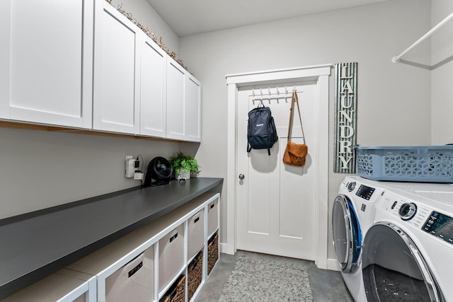 laundry room featuring cabinet space and independent washer and dryer