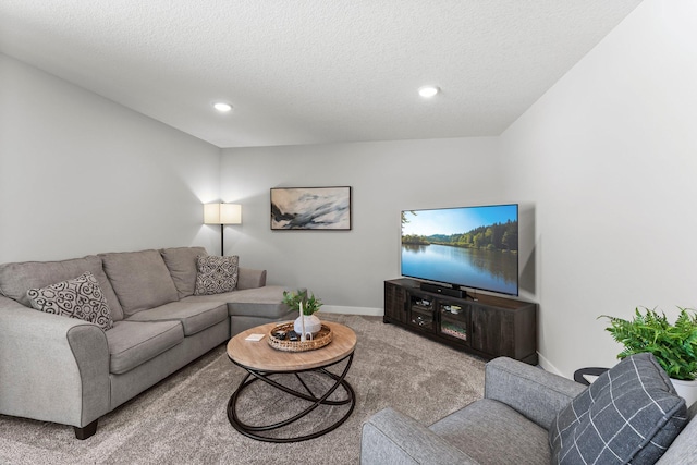 carpeted living area featuring recessed lighting, a textured ceiling, and baseboards