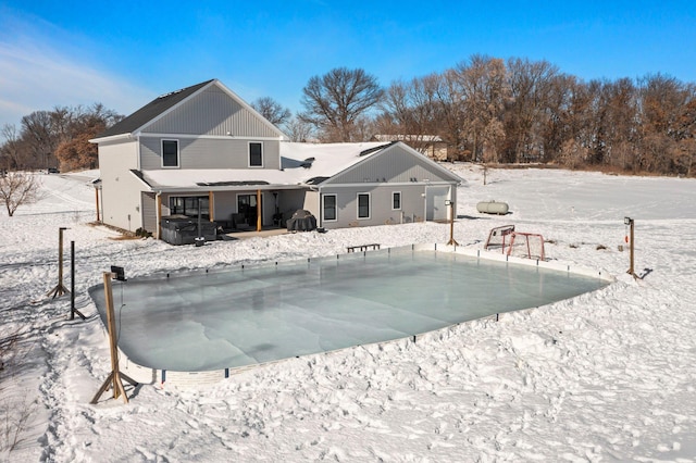 snow covered pool with area for grilling