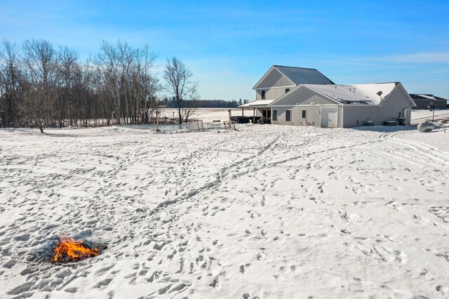 view of snow covered house