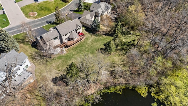 drone / aerial view with a water view and a residential view