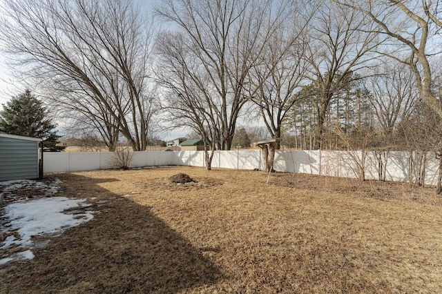 view of yard with a fenced backyard