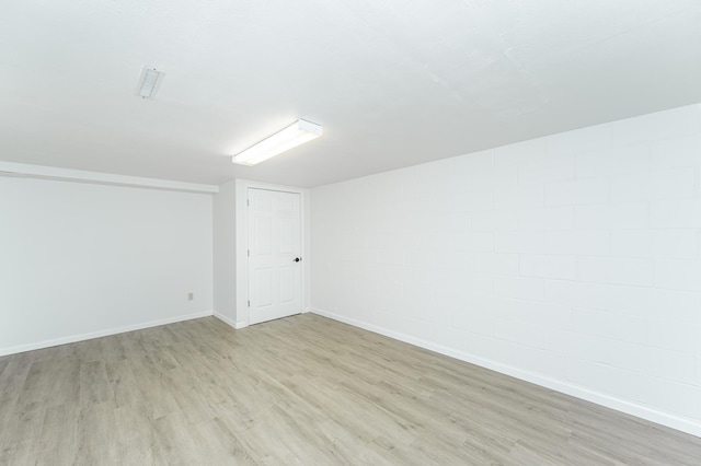 unfurnished room featuring light wood-style floors and baseboards