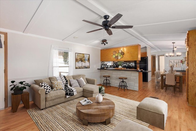 living area featuring light wood-style floors, crown molding, lofted ceiling with beams, and ceiling fan with notable chandelier