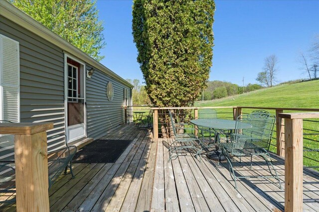 E4970 865th Ave, Sherman Twp, WI 54725 - wooden terrace featuring outdoor dining space and a yard