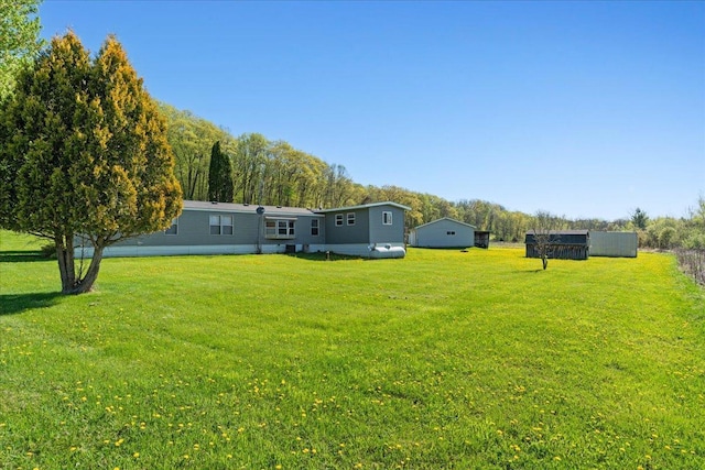 E4970 865th Ave, Sherman Twp, WI 54725 - back of property featuring a lawn and an outbuilding