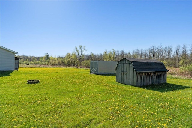 E4970 865th Ave, Sherman Twp, WI 54725 - view of grassy yard featuring a storage shed and an outbuilding