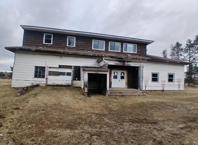 3285 Vermilion Trl, Colvin Twp, MN 55763 - back of house with a garage