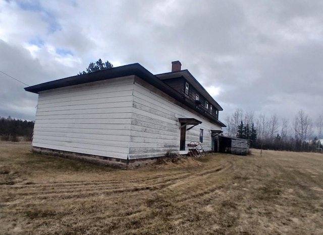 3285 Vermilion Trl, Colvin Twp, MN 55763 - view of side of property with a chimney