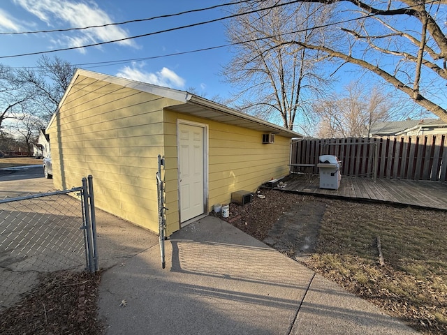 view of outbuilding with fence
