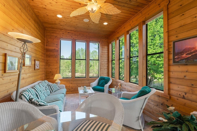 11879 Flanders Cir NE, Blaine, MN 55449 - sunroom / solarium featuring healthy amount of natural light, a ceiling fan, and an outdoor hangout area