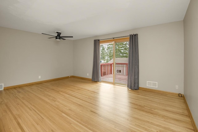 unfurnished room featuring baseboards, visible vents, ceiling fan, and light wood finished floors