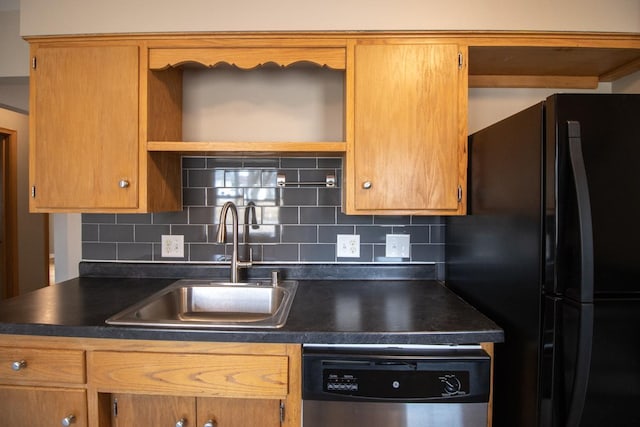 kitchen with a sink, stainless steel dishwasher, freestanding refrigerator, open shelves, and dark countertops