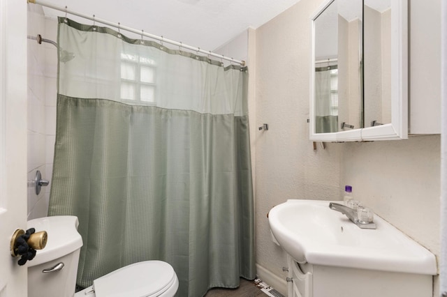 bathroom with vanity, toilet, and a shower with curtain