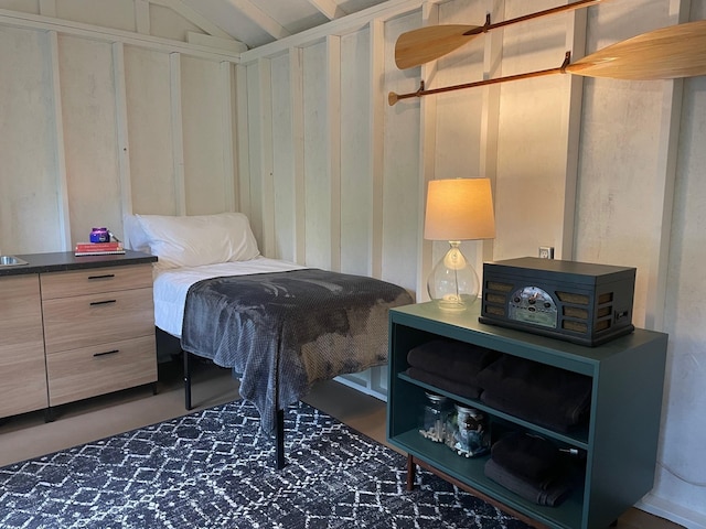 bedroom featuring lofted ceiling