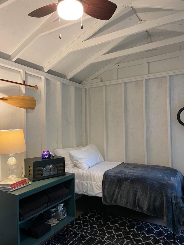 bedroom featuring lofted ceiling with beams and a ceiling fan