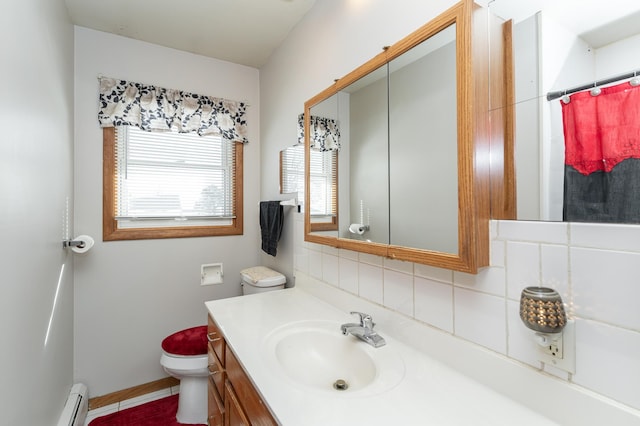 bathroom featuring baseboards, toilet, baseboard heating, vanity, and backsplash