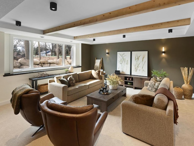 living area with baseboards, carpet flooring, and beamed ceiling