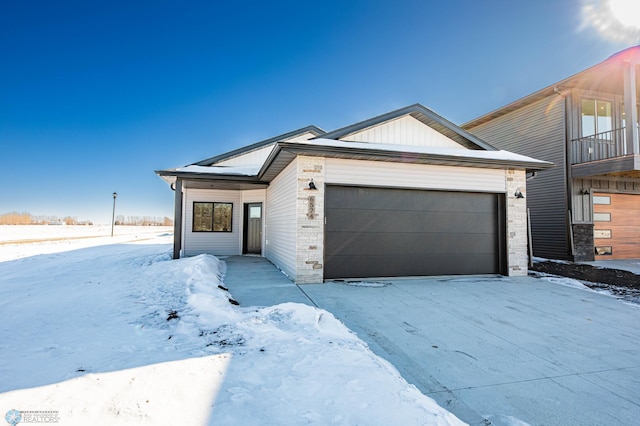 view of front of property featuring a garage and board and batten siding