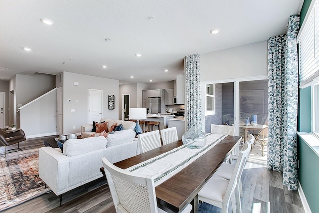 dining area with dark wood-style floors, baseboards, and recessed lighting